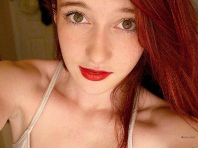 Домашнее видео рыжей красотки с обалденным бюстом